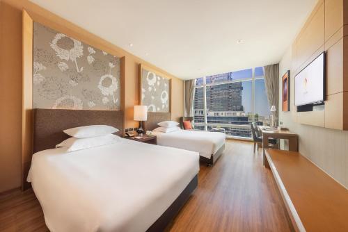 Habitación Executive Superior Doble con acceso al salón - 1 o 2 camas del hotel Eastin Grand Sathorn Bangkok. Foto 1