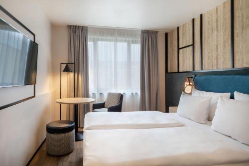 Habitación Deluxe del hotel München City Center affiliated by Meliá. Foto 1