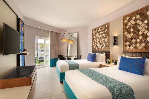 Habitación Premium con vistas al jardín - 2 camas grandes del hotel Secrets La Romana All-Inclusive Adult Only Resort & Spa. Foto 5