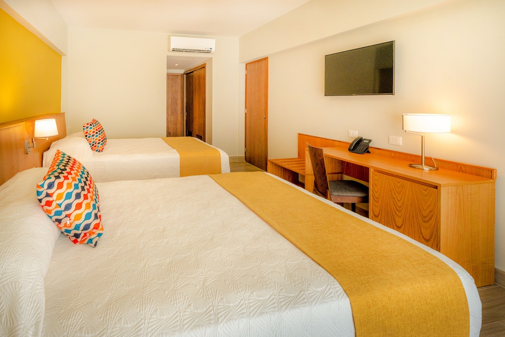 Habitación estándar, 2 camas de matrimonio, vistas al jardín del hotel Coral Costa Caribe Beach Resort - All Inclusive
