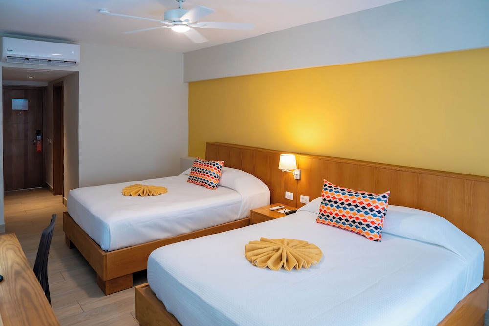 Habitación estándar, 2 camas de matrimonio, vistas al jardín del hotel Coral Costa Caribe Beach Resort - All Inclusive. Foto 4