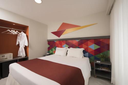 Habitación Executive Deluxe del hotel Novus Plaza Hodelpa. Foto 2
