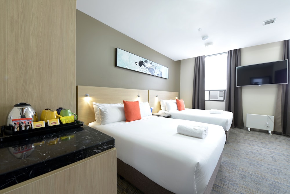 Habitación Doble con Dos Camas Dobles, Accesible para Sillas de Ruedas del hotel Ibis Budget Melbourne Cbd. Foto 1