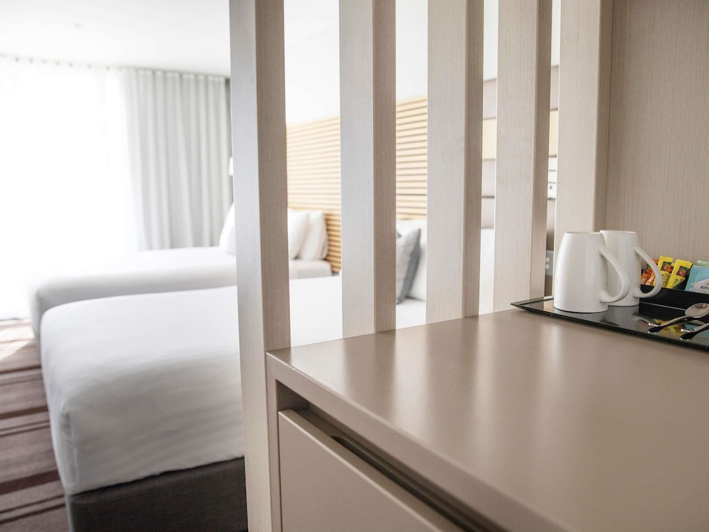 Habitación Superior con 2 camas dobles del hotel Novotel Newcastle Beach. Foto 1