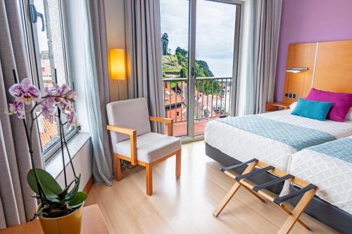 Habitación Superior con vistas a la ciudad - 2 camas individuales del hotel Faranda Marsol Candás. Foto 1