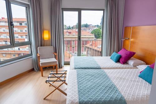 Habitación Superior con vistas a la ciudad - 2 camas individuales del hotel Faranda Marsol Candás. Foto 2