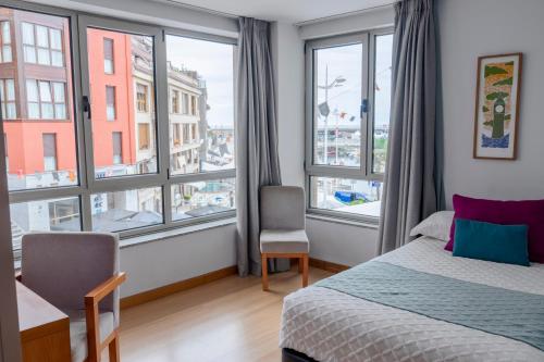 Habitación Superior con cama supletoria y vistas a la ciudad - 2 camas individuales del hotel Faranda Marsol Candás. Foto 1