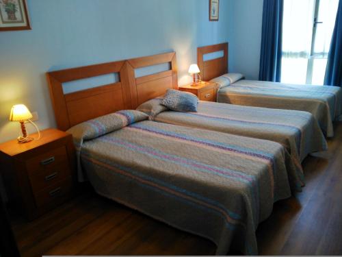 Habitación Doble con cama supletoria - 1 o 2 camas del hotel Aguila Real. Foto 1