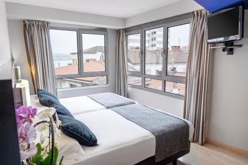 2 camas individuales del hotel Faranda Pathos Gijon, Ascend Hotel Collection