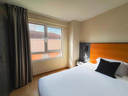 1 cama doble del hotel Faranda Pathos Gijon, Ascend Hotel Collection. Foto 1