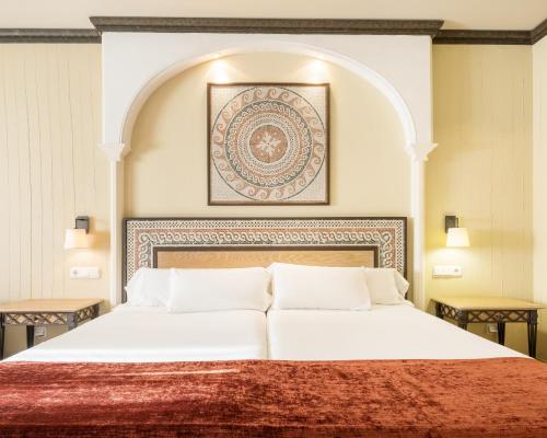 Habitación Triple del hotel Ilunion Merida Palace. Foto 6