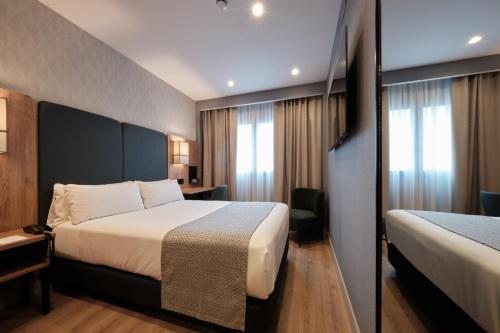 Habitación Individual Deluxe del hotel Catalonia La Maquinista. Foto 1