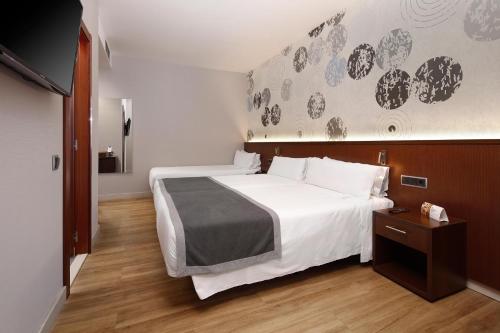 Habitación Doble con cama supletoria - 2 camas del hotel Hcc Taber
