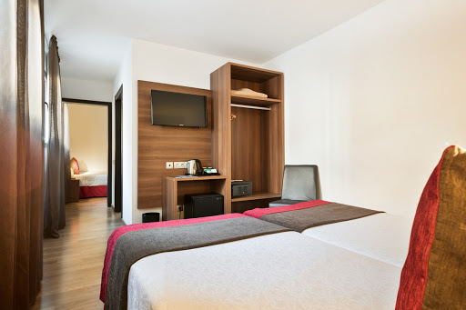 Habitación triple del hotel Best Auto Hogar. Foto 1