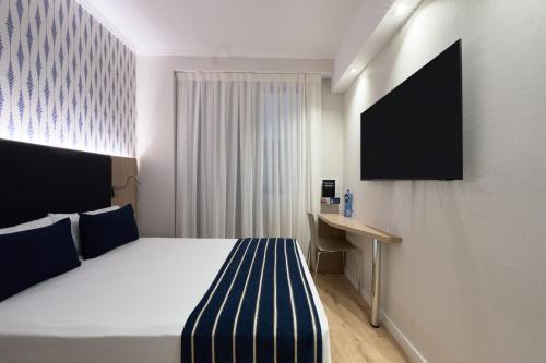 Habitación Individual del hotel Catalonia Roma. Foto 1