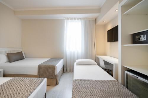 Habitación Triple del hotel Catalonia Roma