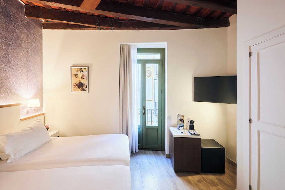 Habitación Classic Barcelona del hotel H10 Racó del Pi Boutique Hotel. Foto 1