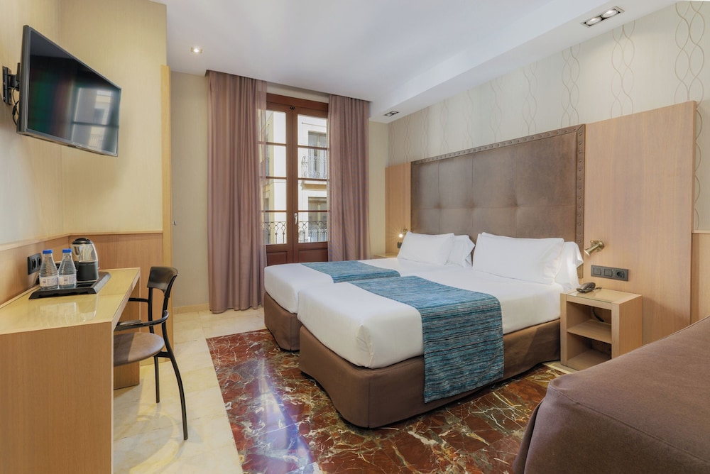 Habitación Triple del hotel Gotico. Foto 1