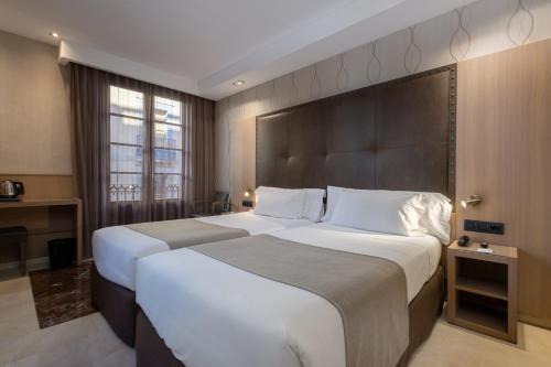 Habitación Doble con cama supletoria - 1 o 2 camas del hotel Gran Barcino. Foto 4