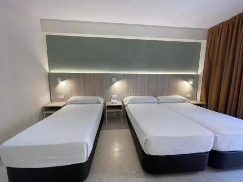 Habitación Doble con cama supletoria del hotel Marconi. Foto 1