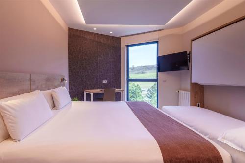 Habitación Triple del hotel Ciudad De Burgos. Foto 2