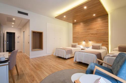 Habitación Doble con cama supletoria - 2 camas del hotel Monte Puertatierra. Foto 1