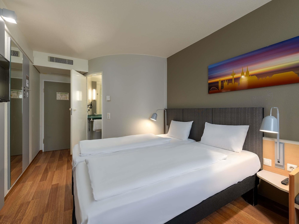 Habitación con camas individuales, nuevo concepto sleep - easy del hotel Ibis Köln Airport. Foto 11