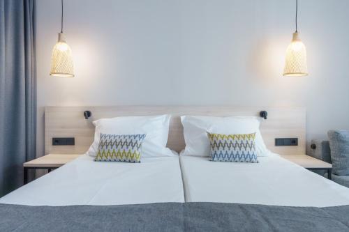 Habitación triple Confort del hotel Dwo Les Palmeres. Foto 4