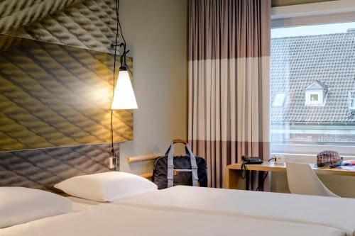 Habitación estándar con camas individuales del hotel ibis Hotel Münster City. Foto 18