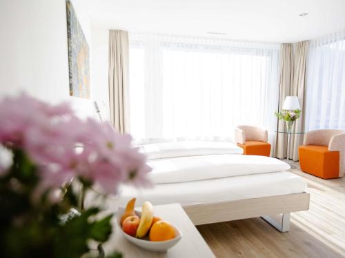 Habitación Superior Esquina con 2 camas individuales, vistas a la montaña del hotel Mercure Chur City West