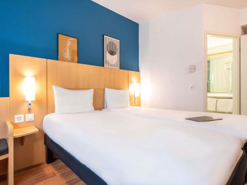 Habitación Estándar - 2 camas individuales del hotel Ibis Geneve Centre Nations. Foto 5