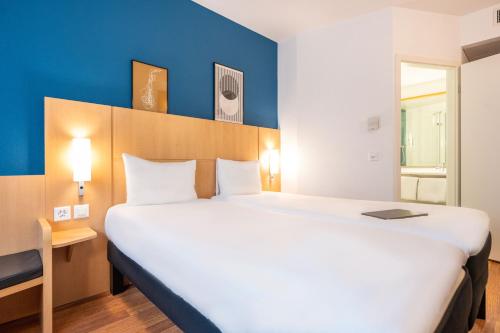 Habitación Estándar - 2 camas individuales del hotel Ibis Geneve Centre Nations. Foto 10