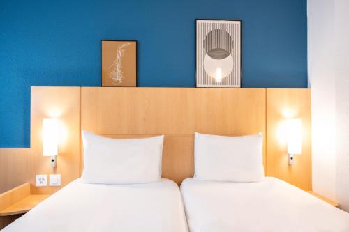 Habitación Estándar - 2 camas individuales del hotel Ibis Geneve Centre Nations. Foto 12