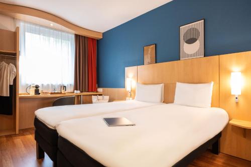 Habitación Estándar - 2 camas individuales del hotel Ibis Geneve Centre Nations. Foto 13