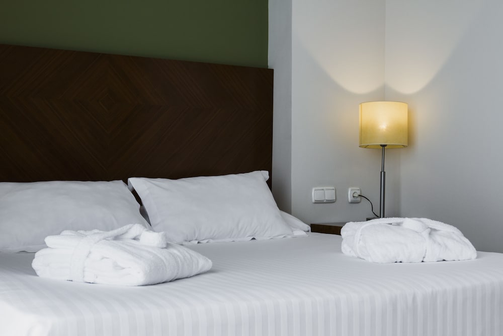 Habitación cuádruple 2 Camas individuales 1 Cama doble Normal del hotel Avenida