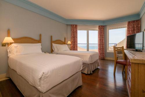 Habitación Doble con vistas al mar y cama supletoria - 1 cama grande o 2 camas individuales del hotel Playa Victoria