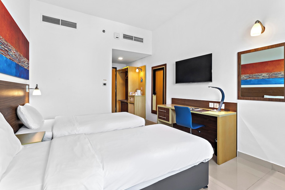 Habitación con 2 camas individuales del hotel Citymax Bur Dubai. Foto 1