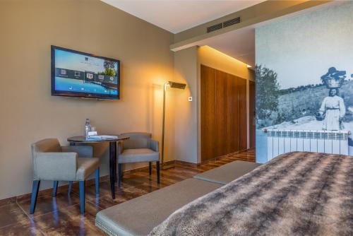 Superior Double Room with Garden and Pool View del hotel AP Lago Montargil Conference & Spa. Foto 2