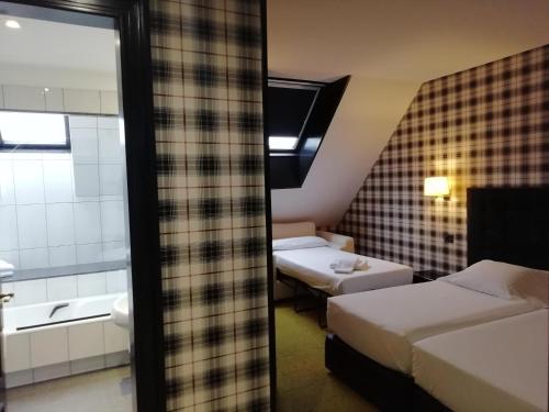 Habitación Doble con cama supletoria del hotel Clarín