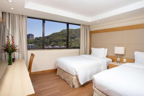 Habitación Doble con vistas al mar - 2 camas del hotel Hilton Copacabana Rio De Janeiro. Foto 1