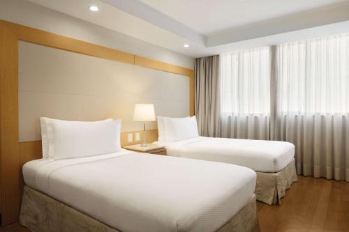 Habitación Doble con vistas a la ciudad - 2 camas del hotel Hilton Copacabana Rio De Janeiro. Foto 1