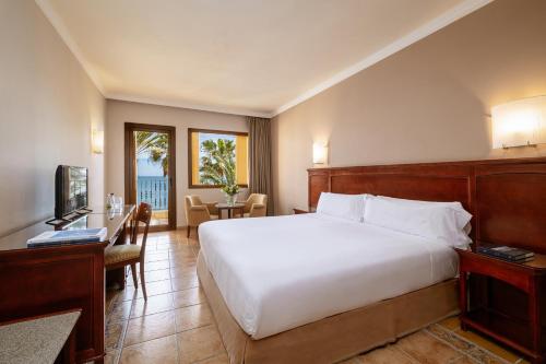 Habitación Doble con cama supletoria del hotel IPV Palace and Spa. Foto 1