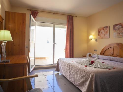 Habitación Doble Romántica del hotel El Pinche de Oro. Foto 18