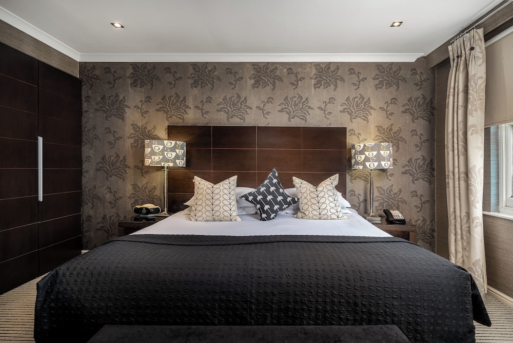 Habitación Deluxe con 1 cama doble o 2 individuales del hotel The Beaufort Knightsbridge. Foto 4