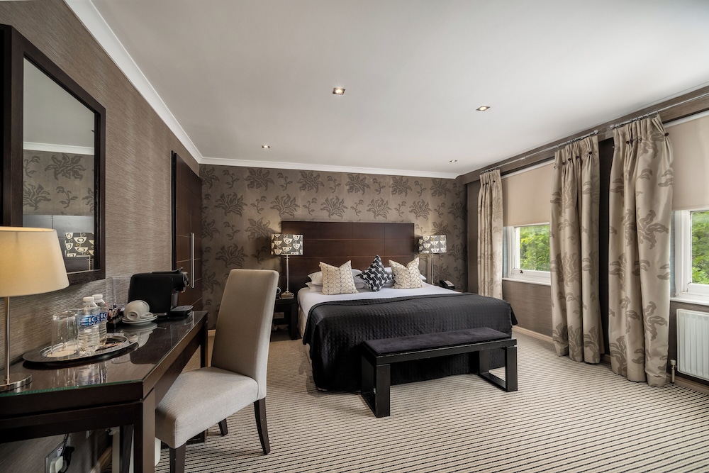 Habitación Deluxe con 1 cama doble o 2 individuales del hotel The Beaufort Knightsbridge. Foto 7
