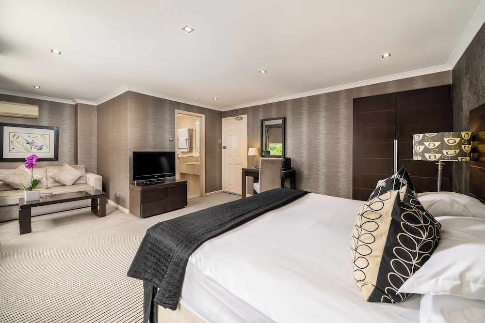 Habitación Deluxe con 1 cama doble o 2 individuales del hotel The Beaufort Knightsbridge. Foto 8