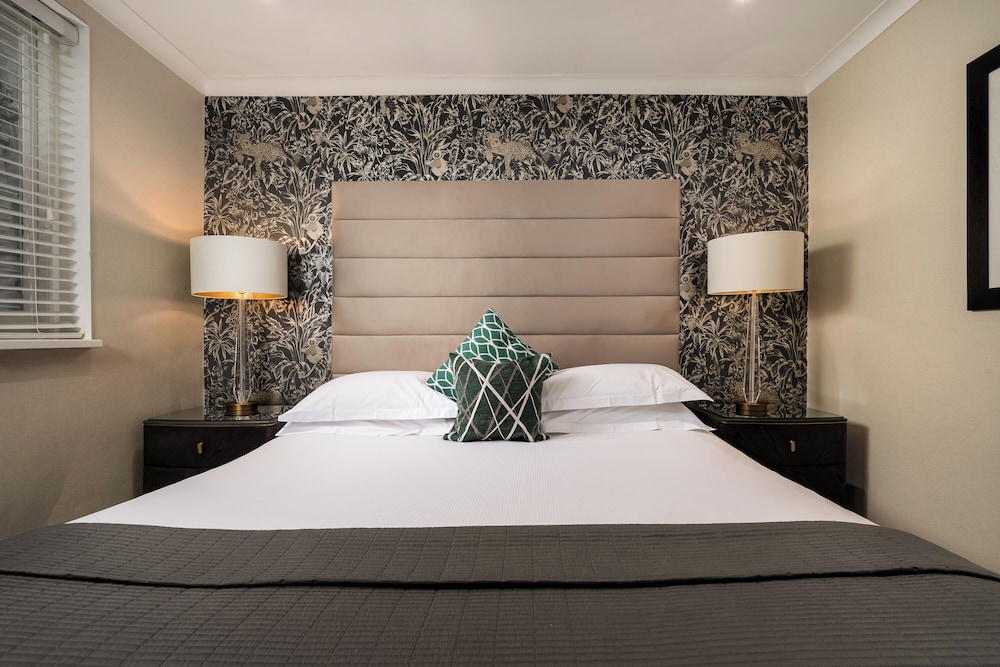 Habitación Deluxe doble del hotel The Beaufort Knightsbridge. Foto 4