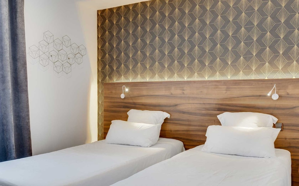 Habitación superior con 2 camas individuales del hotel Carladez Cambronne