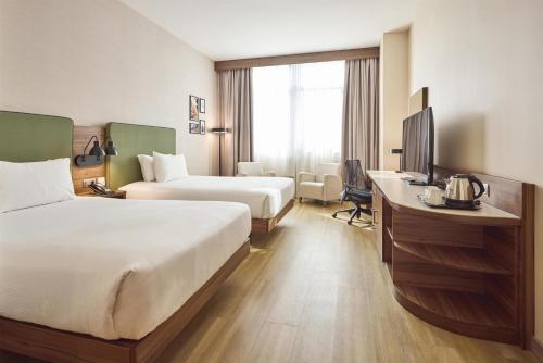 Habitación Doble - 2 camas dobles del hotel Hilton Garden Inn Sevilla. Foto 1