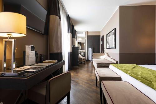 Habitación Triple Executive del hotel Rome Times. Foto 1